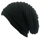 Dreadz, black, slouchy, ribbed dreadlock beanie hat shown as if worn on invisible manneqiun's head, displayed against a white background. This image gives a very good idea of how this black, slouchy, ribbed dreadlock beanie hat will look on your dreads and your head.